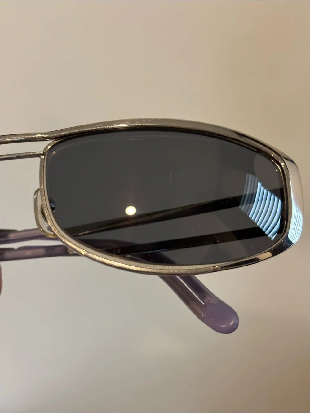 Hiero Elongated Oval Sleek Silver Frame Sunglasses with Dark Lenses
